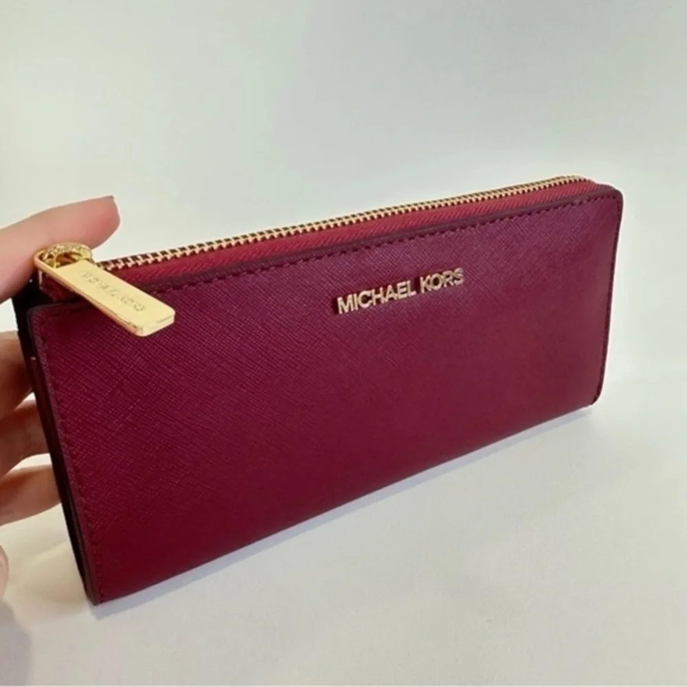 Michael Kors Large three Quarter zip Leather wallet in Mulberry